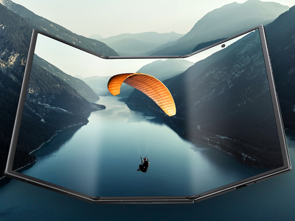 Samsung Galaxy Z TriFold unfolded, showing a paraglider over a mountain lake